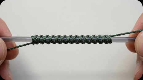 Weave the braid around the leader, alternating sides: one wrap from one side, the next from the other side.